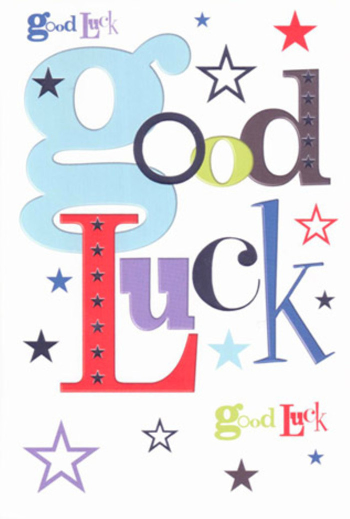 The photograph captures a contemporary good luck card designed with a minimalist yet exuberant flair, resting flat so the entire artwork is visible. Across the white card face, the words Good Luck are spelled out in large, mixed-style letters that dance from left to right. Pastel blue, moss green, cherry red, and deep purple fonts mingle together, each letter styled differently-some chunky and round, others tall and slender-creating a visual rhythm reminiscent of the varied stems, petals, and textures in a thoughtfully arranged bouquet. Dotted all around the lettering is a constellation of stars, scattered as if tossed by hand. They appear in a wide range of blues and purples-inky navy, rich indigo, airy sky-blue, muted lilac-as well as subtle greys, with some stars solid and bold while others are soft, almost whisper-light impressions. The crisp white background acts like fresh wrapping paper, allowing every colour to pop without feeling crowded. You can almost imagine running your fingers over the surface, feeling the smooth, matte card stock and the slight indentation of the printed ink, much like tracing the curves of a silk ribbon around flowers delivered to a doorstep off Brighton Road. There are no photographs or drawings of people or places, only text and stars, yet the overall impression is full of life and encouragement. The design feels perfectly suited to moments of transition in Purley-a student heading off to university, a neighbour starting a new job in London, or a friend launching a new venture-with the card serving as a small, star-sprinkled talisman of belief and support.