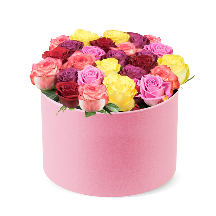 Presented against a clean white background, this stunning, luxurious floral arrangement sits in a soft pink round box, its curved top edge gracefully revealing a dense, domed display of roses. The container, with a velvet-like finish in pale pink, holds about thirty to forty blooms that spill upward in a controlled cascade of color. The roses arrive in a vibrant spectrum: sunny yellow, deep red and burgundy, blush to fuchsia pinks, creams, and regal purple-plum hues interwoven. Each bloom is fully opened, petals smoothly cupped and immaculate, a sign of peak freshness and meticulous care. A few bright green leaves peek between blossoms, adding fresh contrast to the lush color palette. This rose box embodies premium delivery and makes an ideal gift for Valentine's Day, anniversaries, birthdays, or a just-because moment meant to brighten a room. Its sophisticated palette suits contemporary interiors, from Purley living rooms to chic home offices, and it pairs beautifully with stories on luxury gifts, floral trends, or tips for selecting the perfect mixed rose bouquet. Crafted by a local Purley florist who understands the art of balance, this arrangement promises dependable, same-day delivery across Purley and the surrounding Croydon area, bringing a touch of elegance to every celebration.